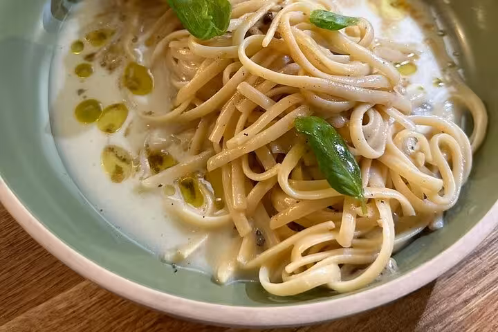 Creamy pasta with basil and olive oil served in class, highlighting a Marseille local chef cooking workshop