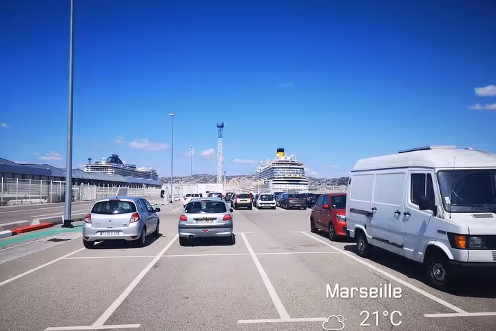 Marseille cruise port pickup point with ships and parking, ideal for transfer to Marseille Provence Airport