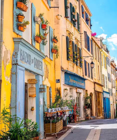Colorful Marseille old town street with pastel facades and shopfronts, perfect for a 3-day local tour