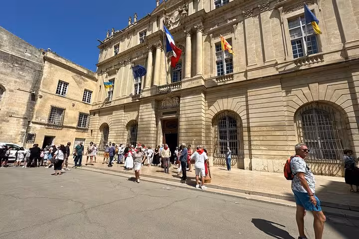 Tourists outside Arles City Hall on a Marseille private shore excursion to Arles, Les Baux and Saint-Remy