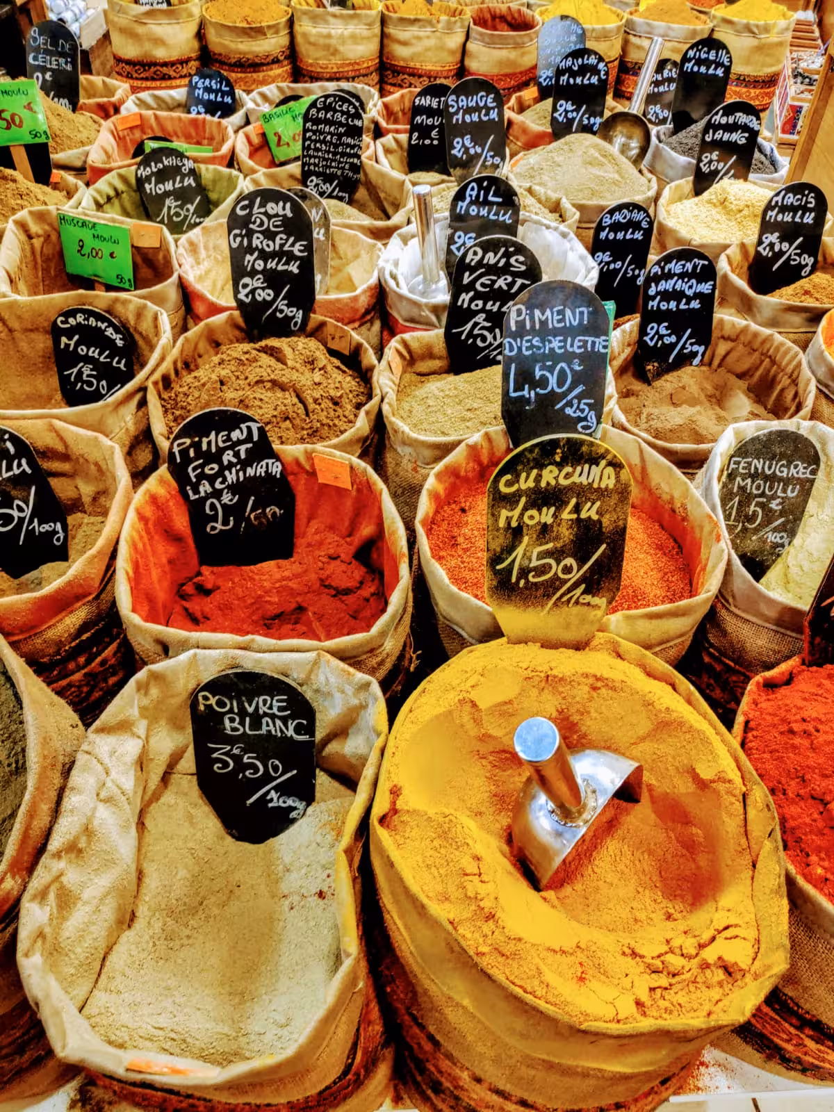 Colorful spice sacks at Marseille market, a local food stop on a 3-day Marseille like a local tour