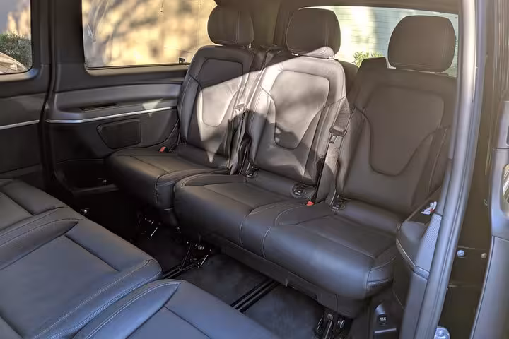 Spacious leather rear seats in private Marseille transfer van for airport, port, hotel and train station pickup
