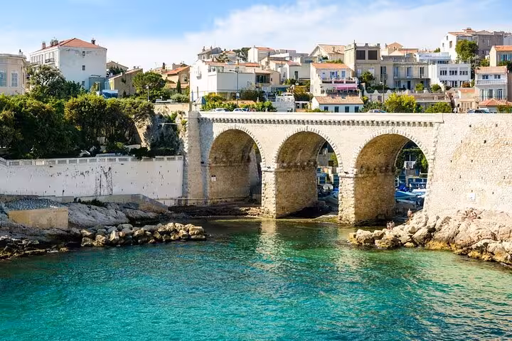 Vallon des Auffes stone bridge and turquoise sea in Marseille, scenic photo stop on a private driver tour