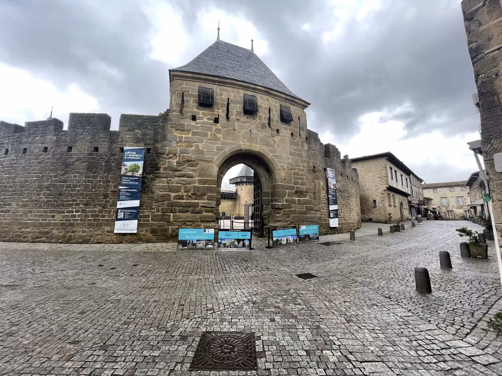Medieval gate at Carcassonne citadel on private shore excursion from Sète to Narbonne and Carcassonne