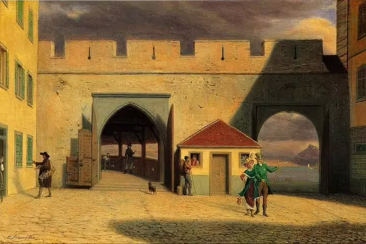 Medieval gateway and cobblestone street in Lucerne, ideal setting for a private nightwatchman walk.