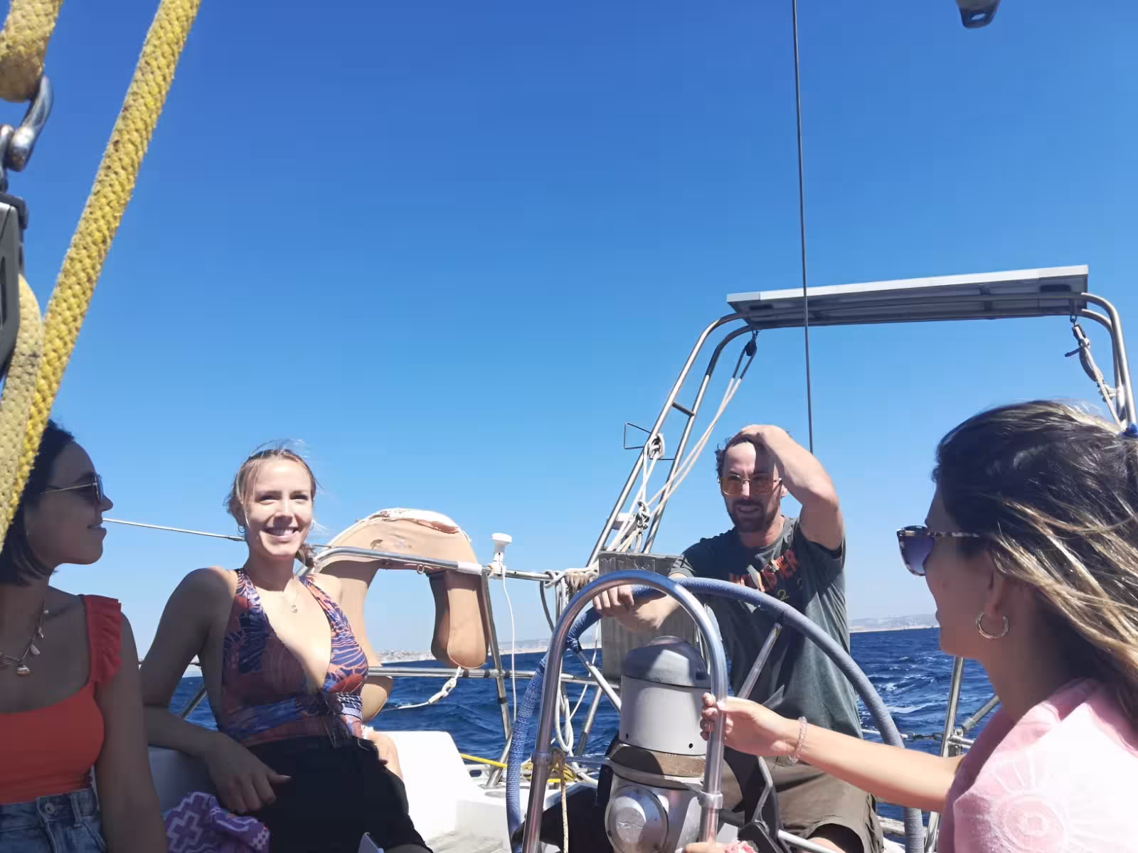 Small group sailing in the Mediterranean on a 3-day boating and snorkeling tour, sunny deck and open sea