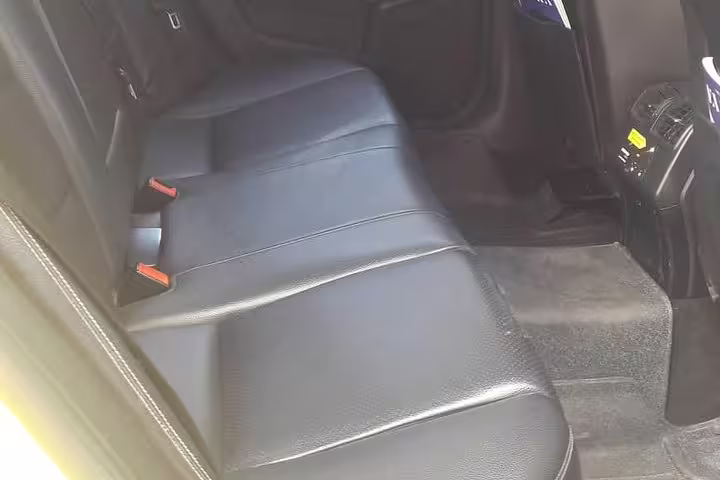 Spacious leather rear seats in Mercedes for private transfer Athens to Porto Heli Amanzoe, premium comfort