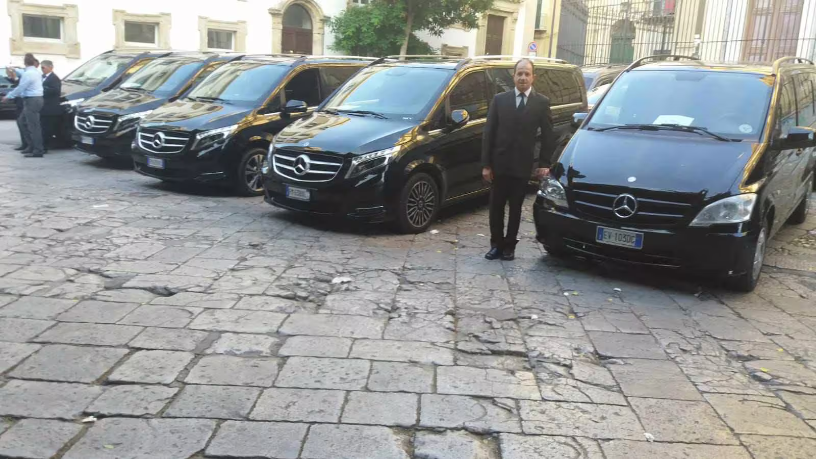 Black Mercedes minivans with professional driver ready for private transfer service between Naples and Benevento, Italy