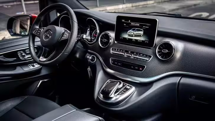 Modern Mercedes interior with leather seats and infotainment system used for direct private transfers Naples to Capri