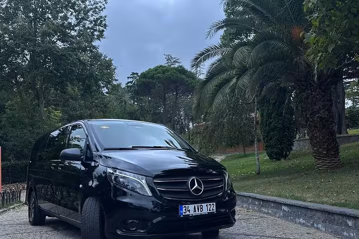 Mercedes V-Class private car rental with driver on a scenic route, comfortable chauffeured tour service