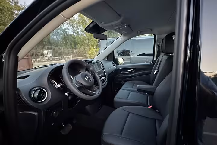 Spacious and comfortable interior of a Mercedes van for private transfer from Naples to Sorrento.