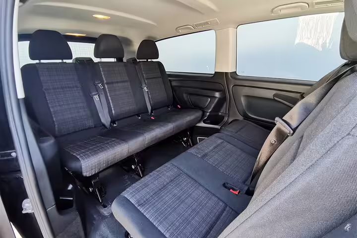 Spacious interior seating of a Mercedes van for comfortable private transfers across popular Portuguese destinations.