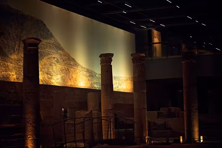 Museum hall with ancient stone columns and ruins, highlight of an all-inclusive 10-day Mesopotamia tour