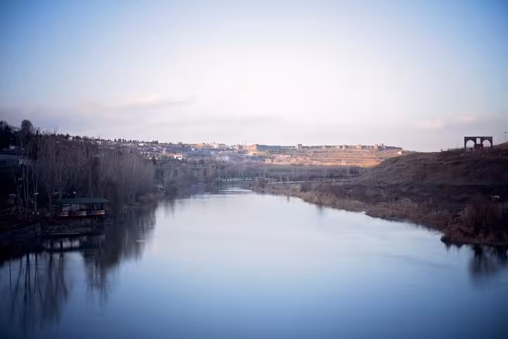 Wide river valley and town skyline at sunset, scenic stop on an all-inclusive 10-day private guided Mesopotamia tour