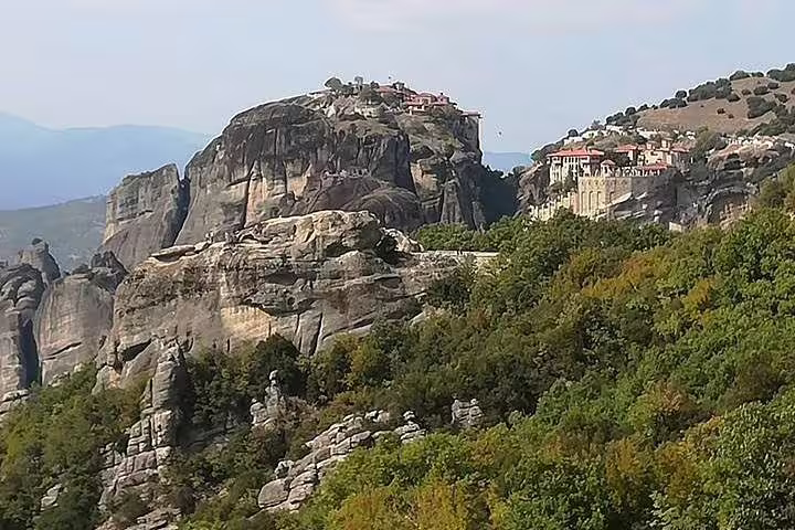 Panoramic Meteora rock formations and monasteries from Kalabaka, Greece, on private transfer route to Athens