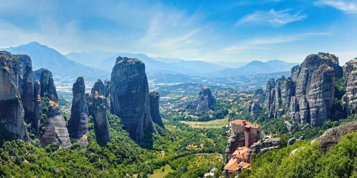 Panoramic Meteora rock pillars and valley view, key highlight of the 2-day Delphi & Meteora tour from Athens