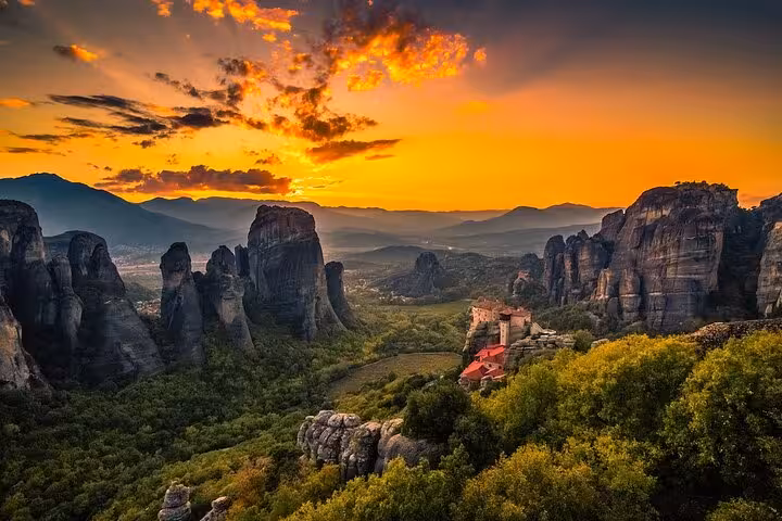 Meteora sunset view with towering rock pillars and cliffside monastery on a 2-day Delphi and Meteora private tour