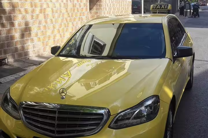 Taxi-style Mercedes transfer vehicle for full-day Meteora and Vergina day trip from Athens including dinner