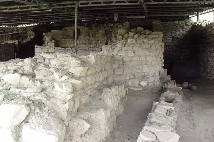 Excavated stone walls at Metropolis Ancient City archaeological site, cultural highlight on a guided wine tour