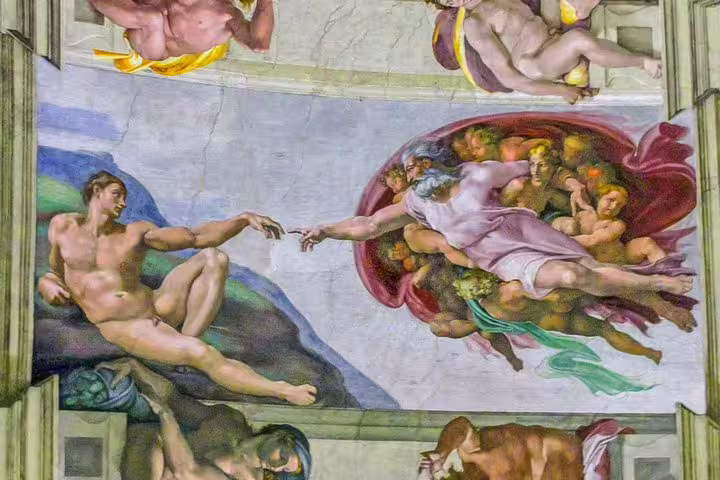 Close-up of Michelangelo’s Creation of Adam on the Sistine Chapel ceiling, visited on a Vatican Museums fast track tour