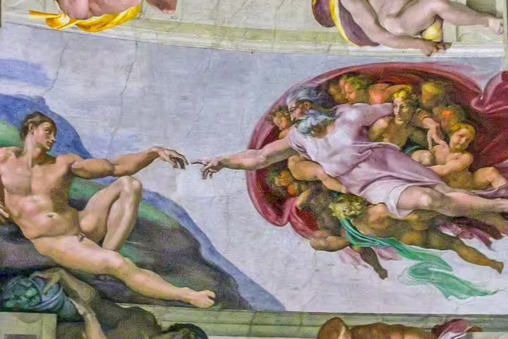 Michelangelo’s Creation of Adam fresco on the Sistine Chapel ceiling, seen on an exclusive Vatican Museums fast track tour