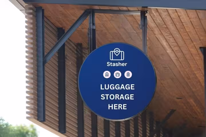 Stasher luggage storage sign outside near Milan Central Station, secure bag drop for travelers