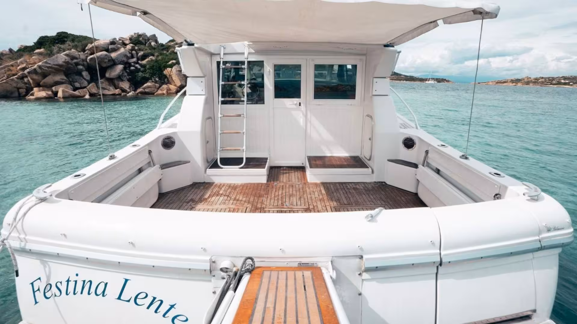 Spacious deck of a mini yacht in La Maddalena, perfect for a tranquil sea excursion.