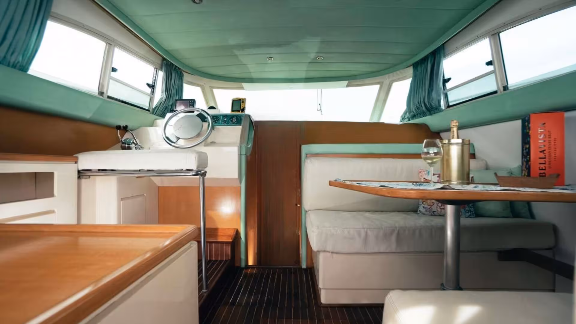Luxurious interior of a mini yacht, featuring a cozy seating area and elegant decor in La Maddalena.