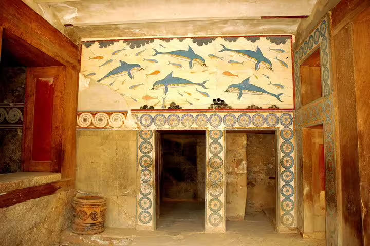 Minoan dolphin fresco inside Knossos Palace rooms, highlight of skip-the-line private half-day tour from Heraklion