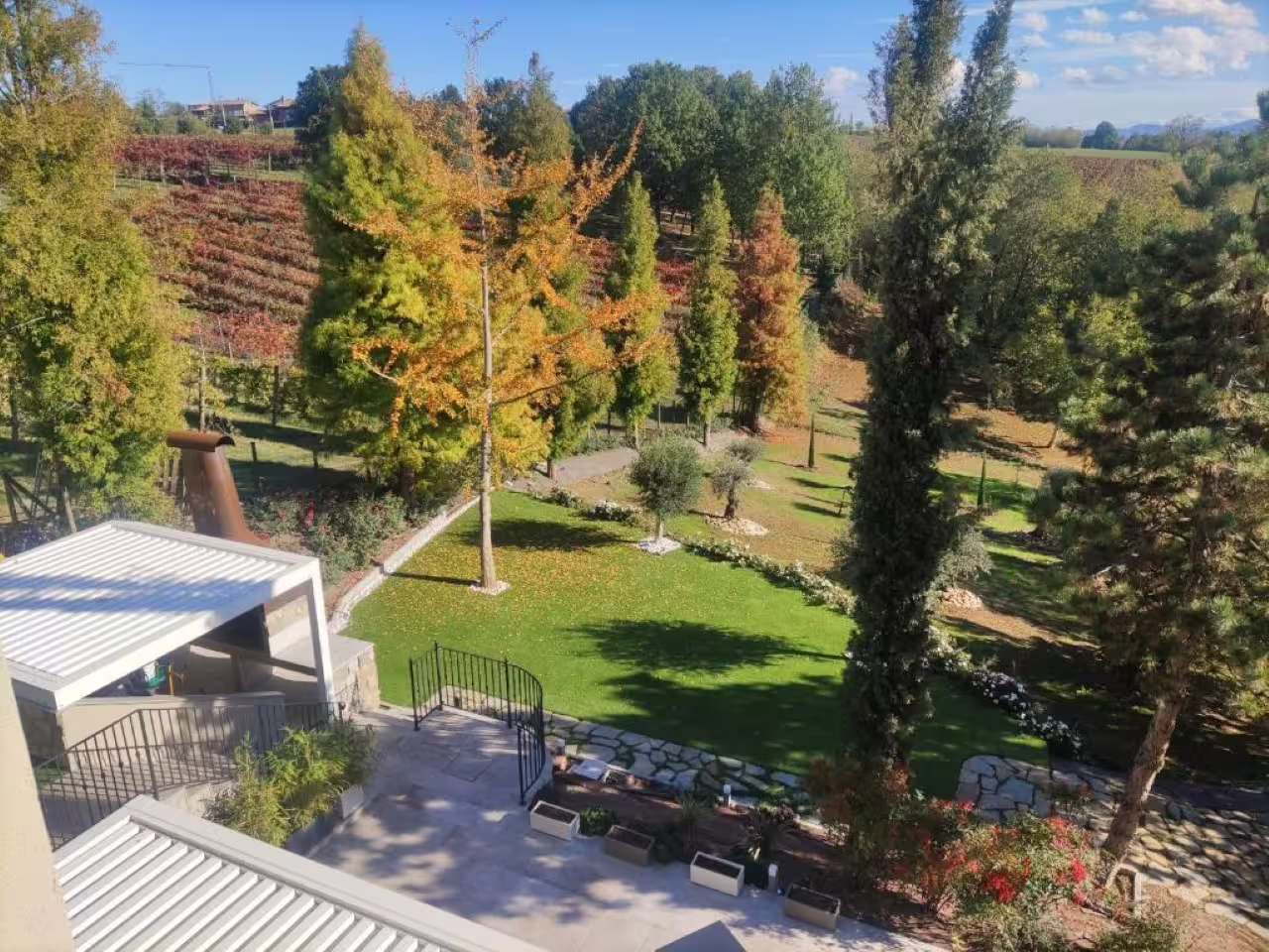 View of Modena vineyards and garden estate near a traditional acetaia, part of a balsamic vinegar cellar tour