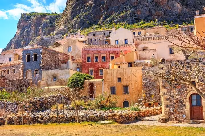 Traditional stone houses in Monemvasia old town beneath cliffs, scenic highlight of 2-day private Peloponnese tour