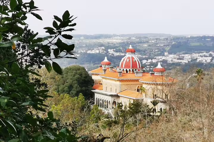 View of the stunning Monserrate Palace nestled in lush greenery, featured on a private Sintra tour with monument tickets from Lisbon.