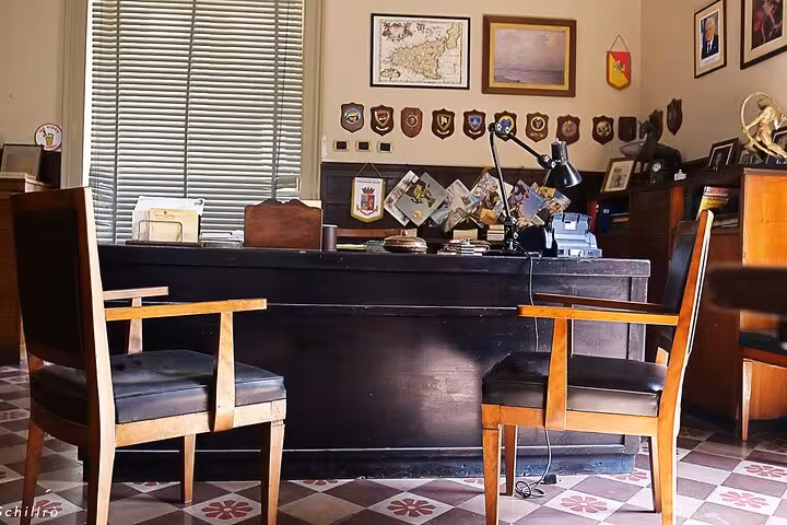 Authentic interior of Montalbano's office with vintage decor, a highlight of the Il Commissario Montalbano tour.