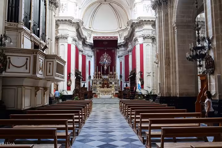 Elegant church interior in Sicily, showcasing baroque architecture, a key setting in Il Commissario Montalbano series.
