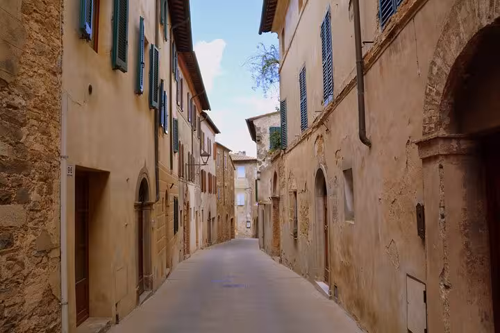 Charming narrow street in Montalcino showcasing rustic Tuscan architecture, perfect for a private day trip exploration.