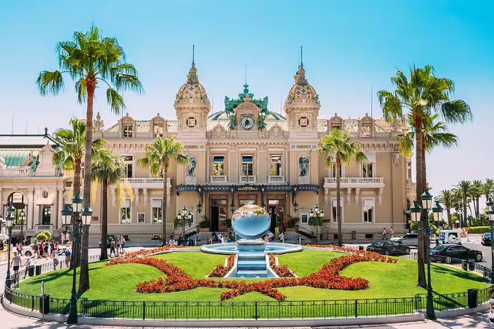 Monte Carlo Casino in Monaco with palm-lined gardens, iconic sight on a private French Riviera highlights tour