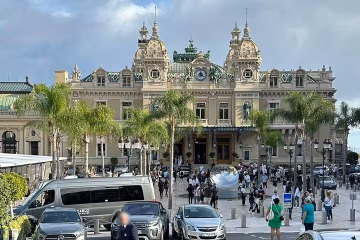 Monte Carlo Casino Square in Monaco with palm trees, iconic stop on private sightseeing tour from Cannes and Nice