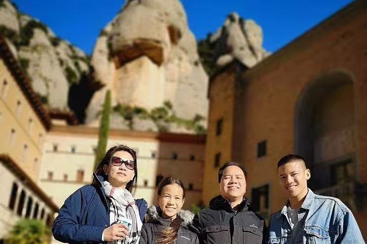 Group enjoying Montserrat Private Tour with La Moreneta access, set against the stunning backdrop of Montserrat's unique rock formations.