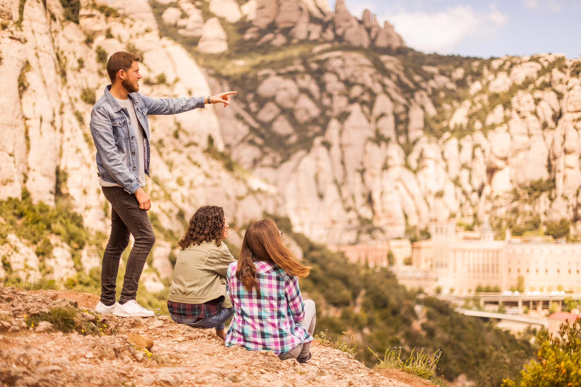 Tourists admiring Montserrat's stunning mountain landscape, a highlight of the Late-start Montserrat tour.