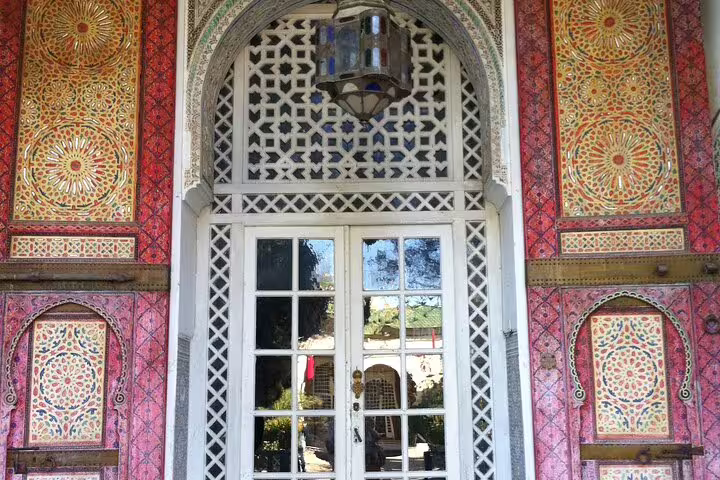 Colorful Moroccan zellige tile doorway in Fes, showcasing intricate mosaic art on Your Own Morocco city tour