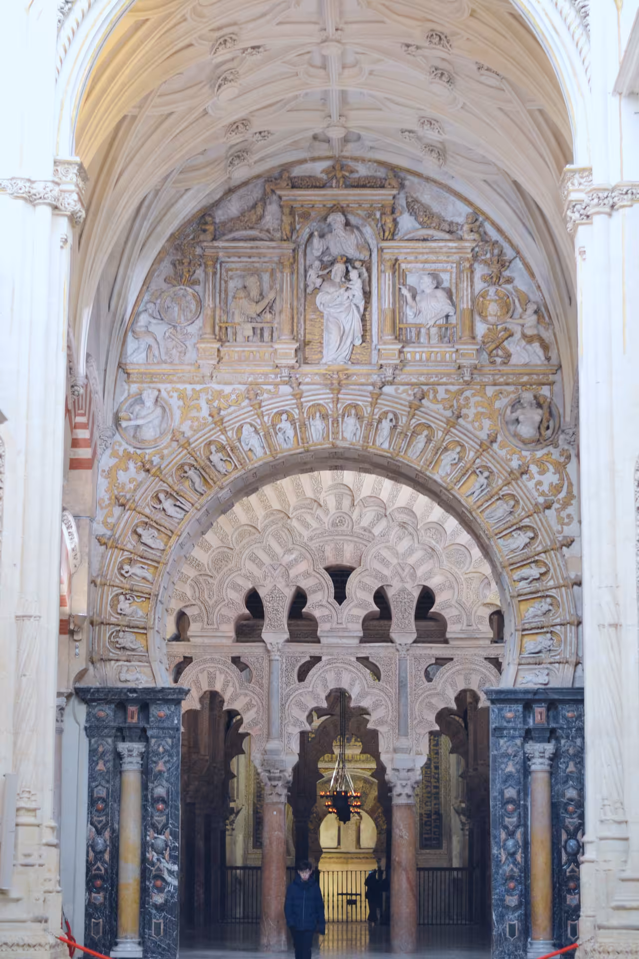 Stunning arches and ornate carvings inside the Mosque-Cathedral of Córdoba, highlighting its unique architecture.
