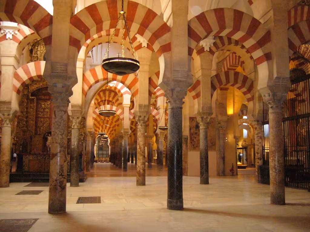 Explore the stunning arches and columns of the Mosque-Cathedral of Córdoba on an enriching guided tour.