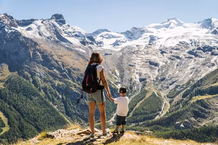 Mother and child hiking viewpoint over Jungfrau glaciers on Swiss Alps tour from Zurich Airport