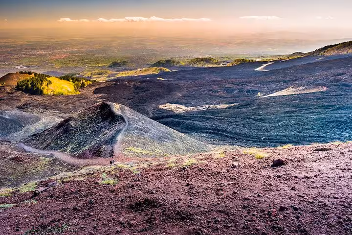 Breathtaking landscape view of Mount Etna's volcanic terrain, a highlight of shore excursions from Messina port.
