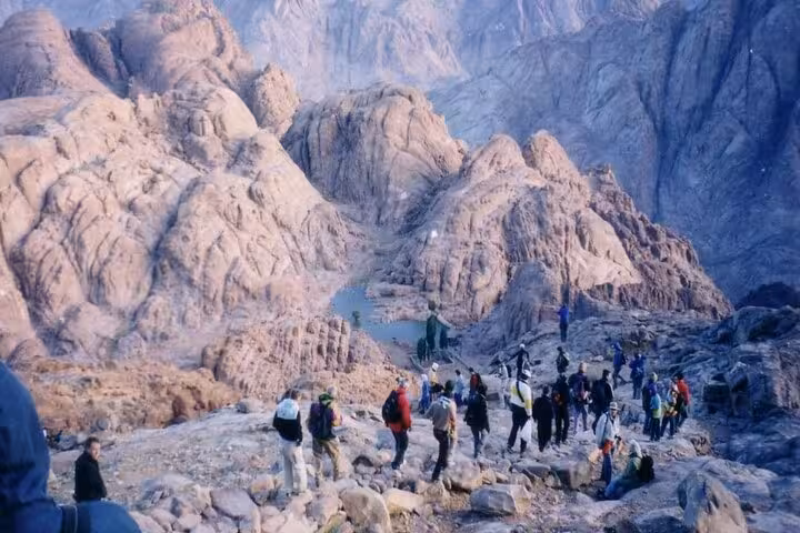 Hikers descending Mount Sinai trail at dawn on Sharm El Sheikh tour to St Catherine’s Monastery