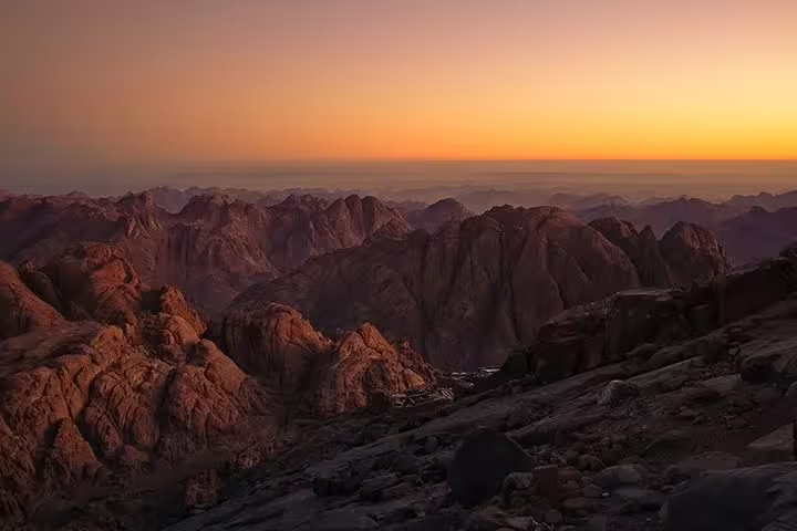 Golden sunset over Mount Sinai peaks during overnight Cairo trip to St Catherine Monastery and Sinai hike