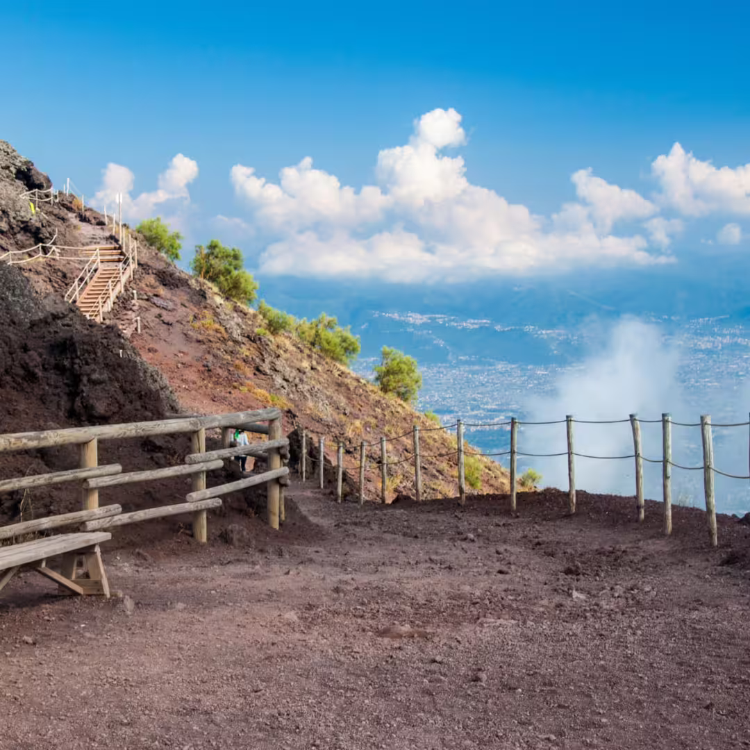 Scenic hiking trail along Mount Vesuvius rim overlooking Bay of Naples on small-group volcano and wine tasting tour