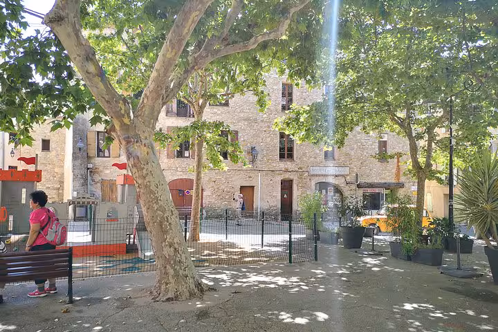 Shaded square in Moustiers-Sainte-Marie, Provence stop on private day trip from Marseille to Lake Sainte-Croix