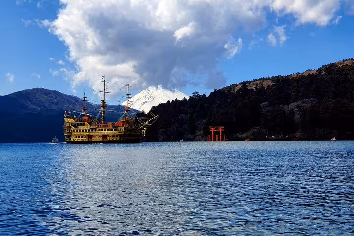 Scenic view of a pirate ship on Lake Ashi with Mt. Fuji in the background, part of a customizable Hakone tour.