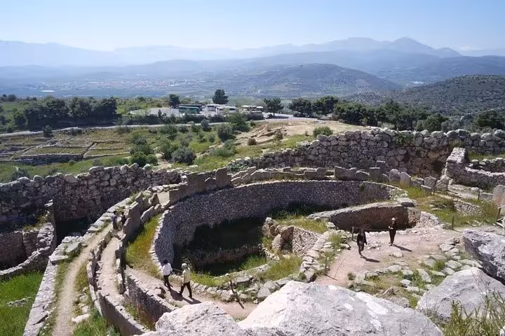 Circular Mycenae archaeological site ruins overlooking Argolis valley on a private luxury tour from Athens